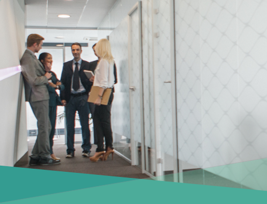 The image features a Mac desktop with a cup of pens, a glass flower pot, and a wooden alligator toy.